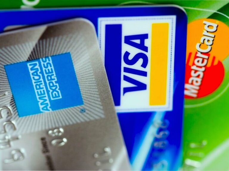 Three overlapping credit cards representing popular brands, including American Express, Visa, and MasterCard, symbolizing common options for credit and rewards.