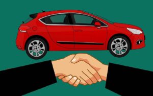 Illustration of a handshake in front of a red car, symbolizing a car rental agreement.